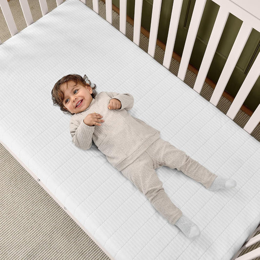 New Delta Children Sweet Beginnings Dual-Sided Crib & Toddler Mattress (White) - Kidsy