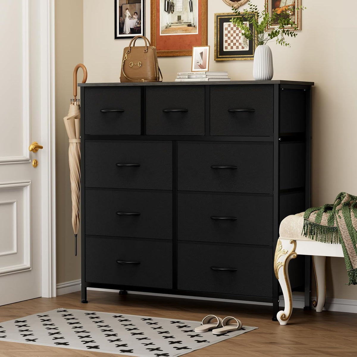 Black dresser with decorative items in a room setting
