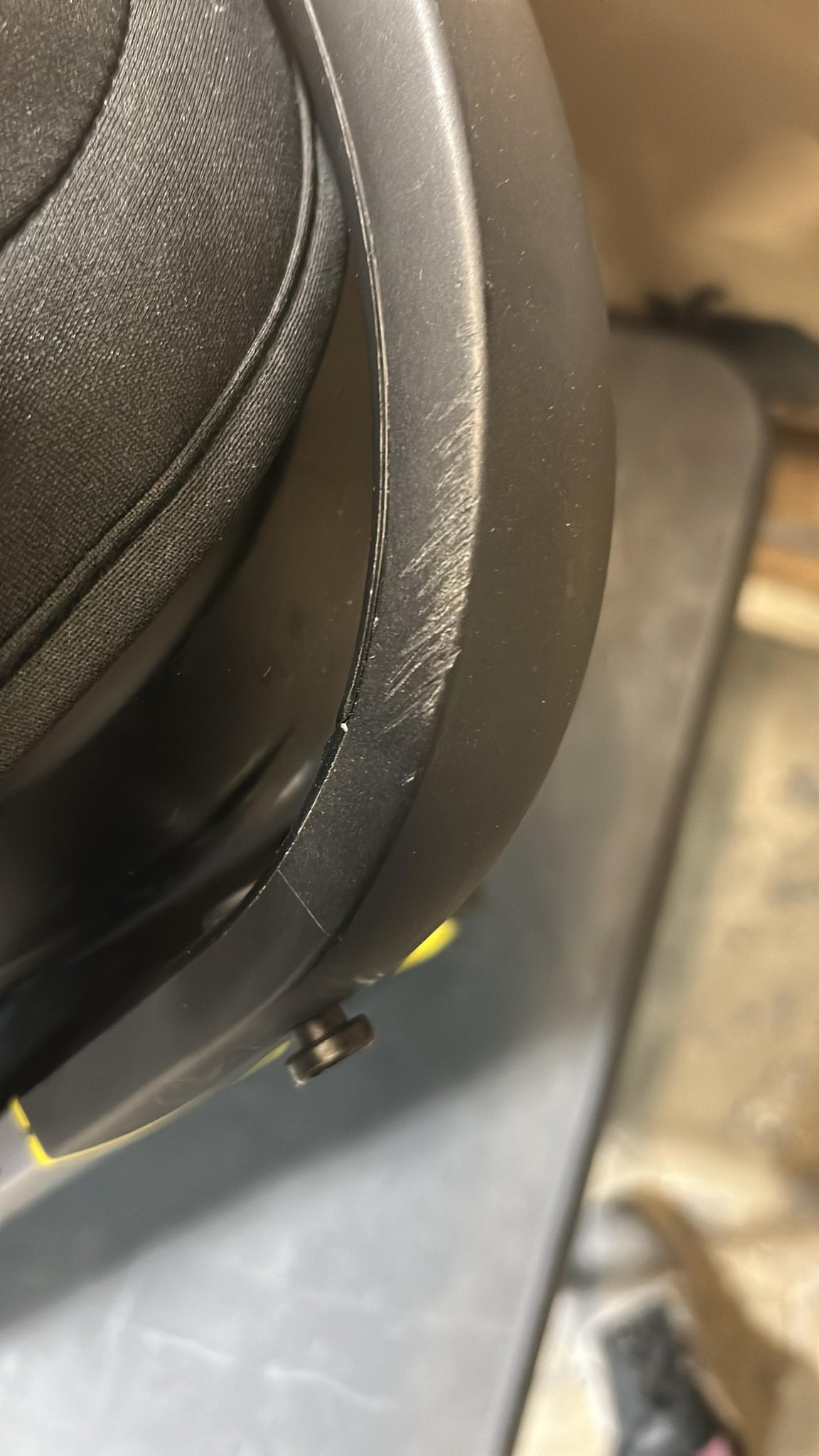 Close-up of a black car seat with a blurred background