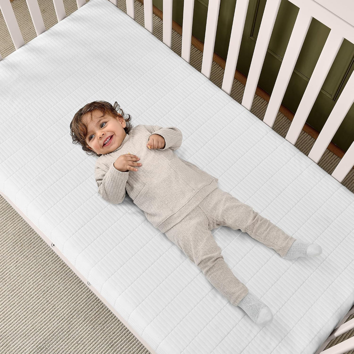 New Delta Children Sweet Beginnings Dual-Sided Crib & Toddler Mattress (White) - Kidsy