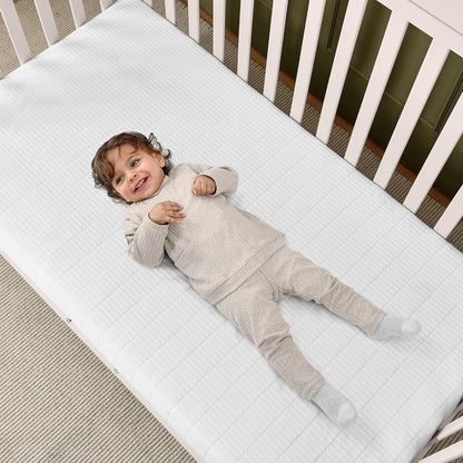 New Delta Children Sweet Beginnings Dual-Sided Crib & Toddler Mattress (White) - Kidsy